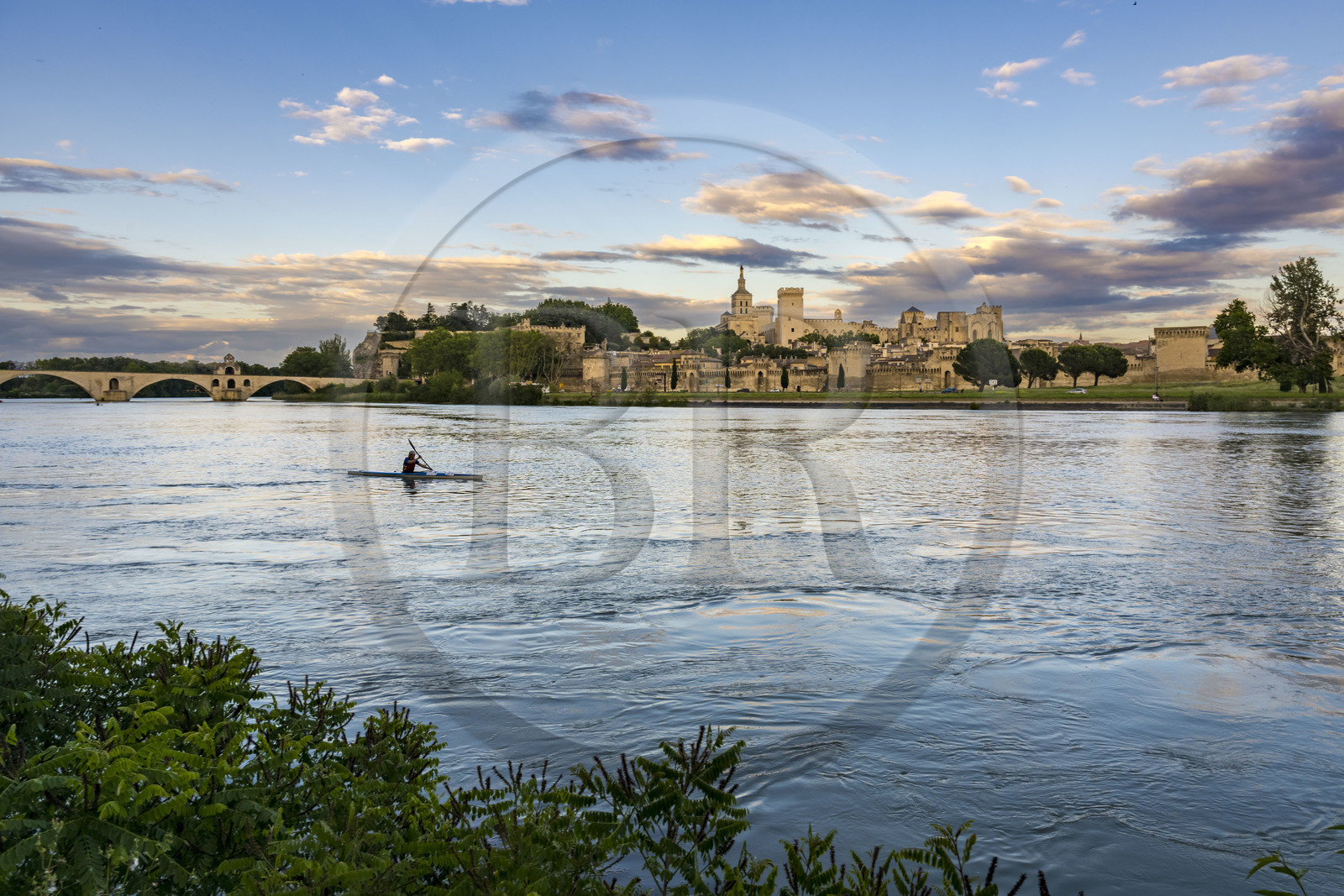 France, Vaucluse, Avignon, kayak passing on the Rhone in front of the Doms Cathedral and the Palais des Papes (Palace of the Popes) listed as World heritage by UNESCO