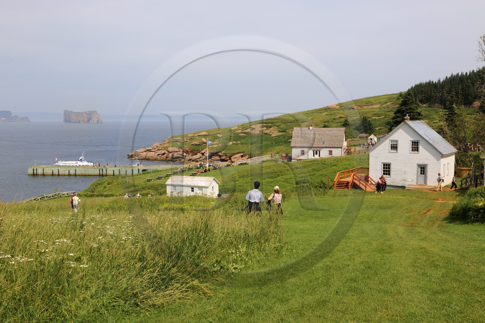 Canada, Quebec Province, Gaspesie, Ile Bonaventure (Bonaventure Island), coastal village of wooden houses and the Rocher Perce (Perce Rock)