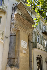 France, Bouches du Rhone, Arles, columns of Saint Lucian, half-pediment and two Corinthian capitals, the only remains of a small temple (2nd century) of the ancient Roman forum on the current place du Forum, listed as World heritage by UNESCO