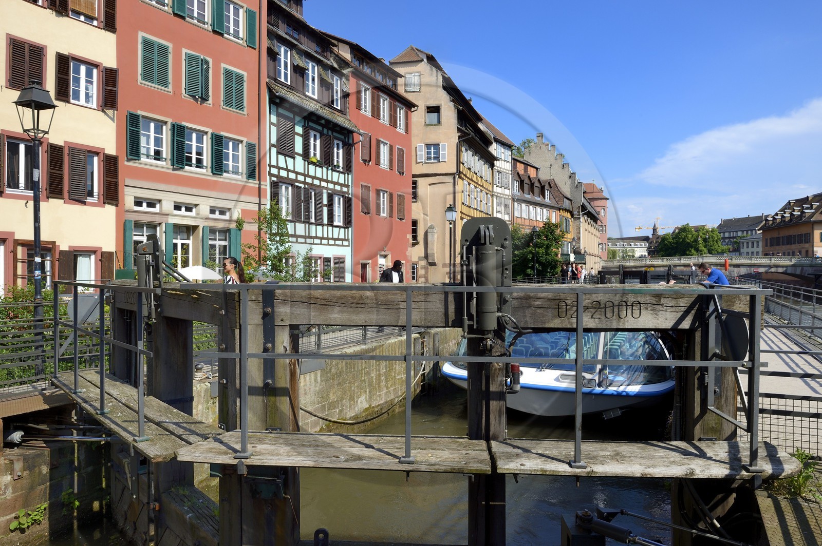 France, Bas Rhin, Strasbourg, old town listed as World Heritage by UNESCO, Petite France District, riverboat at the Ill river lock on to the quai des Moulins