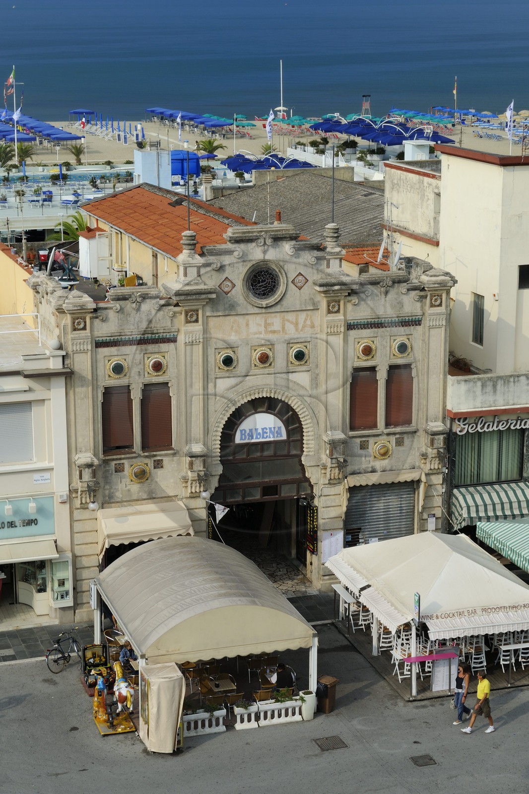 Italy, Tuscany, province of Lucca, seaside resort of Viareggio, the Passeggiata or promenade with its cafés and shops, the building of the Bagno Balena bath on the Lungomare