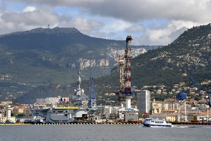 France, Var, Toulon, the naval base (Arsenal), the Charles de Gaulle nuclear-powered aircraft carrier on mid-life renovation and the mont Caume in the background