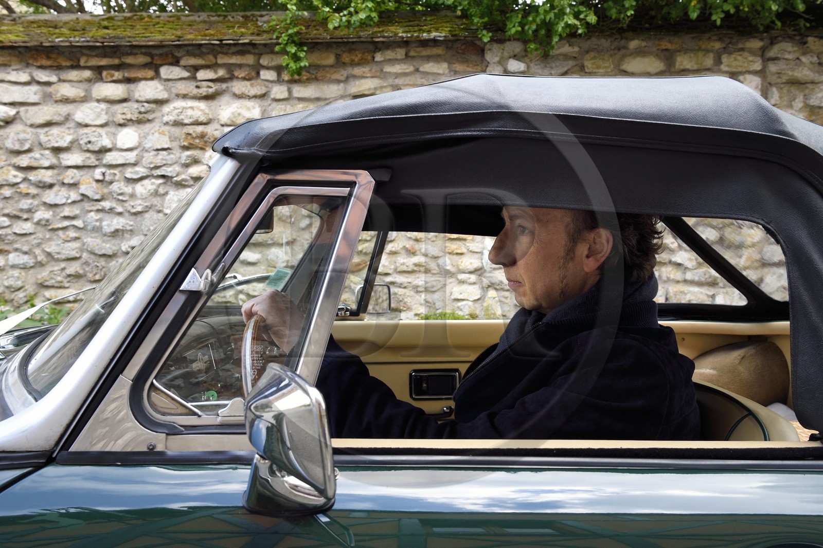 France, Yvelines, Montchauvet, shooting for the television of the Preferred Village of the French (Village Préféré des Français) with Stéphane Bern, Stéphane Bern driving a MG convertible