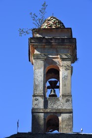 France, Alpes-Maritimes, Roya Valley (Nice hinterland), at the foot of the Mercantour National Park, Saorge, glazed tiles bell tower of the red Penitents St. Sebastian chapel