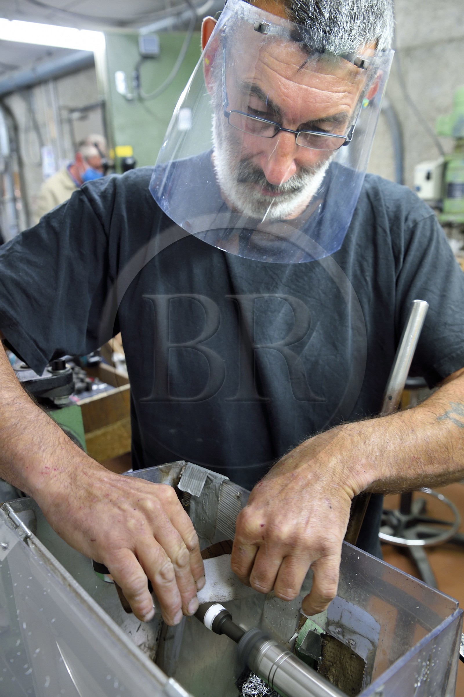 France, Dordogne, Périgord Vert, Nontron, handcrafted knives in the Coutellerie Nontronaise Factory, handle finish