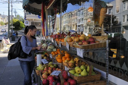 United States, California, San Francisco, Castro District, Gay District, fruits and vegetables stand in front of a grocery's shop