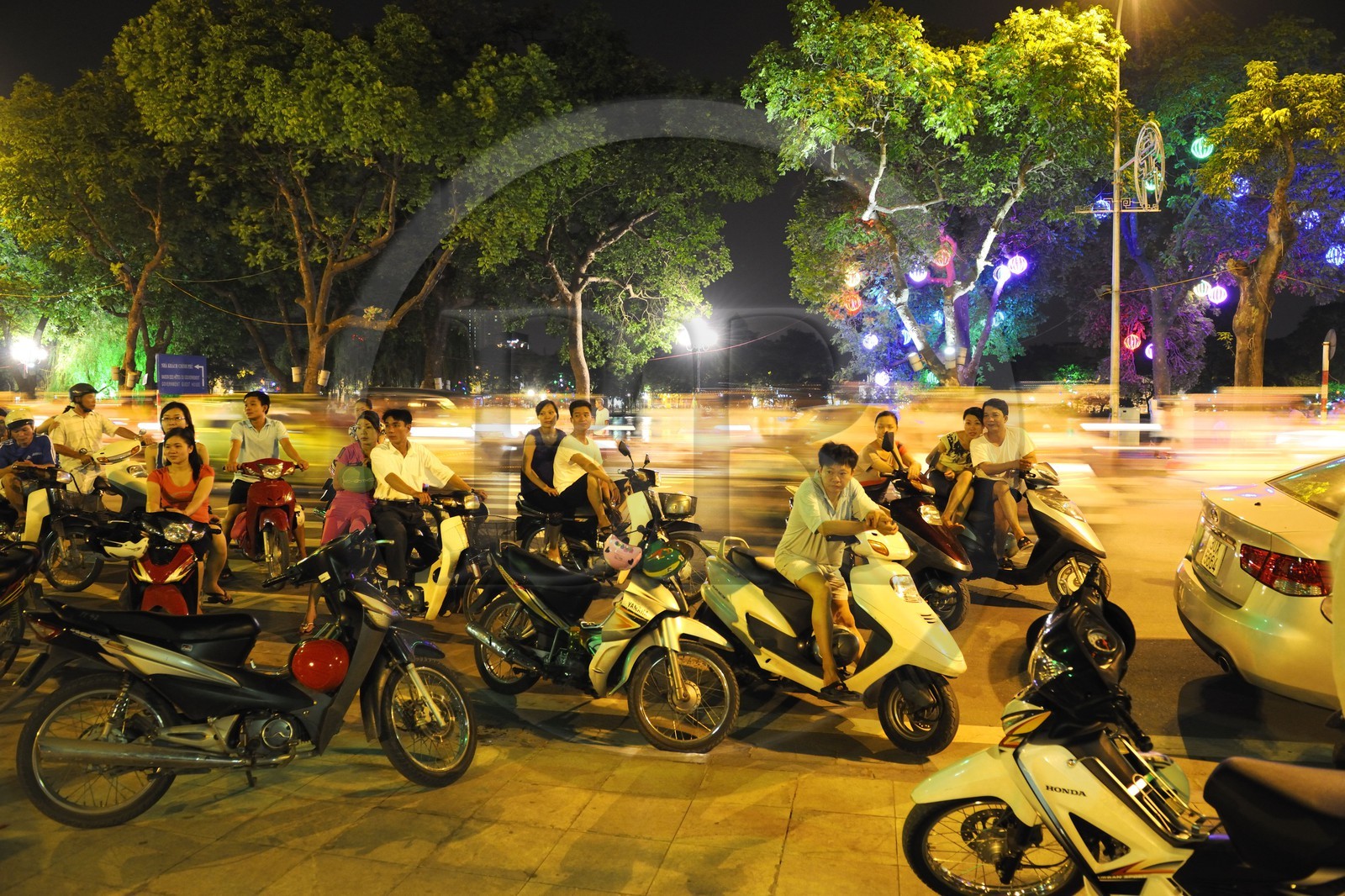 Vietnam, Hanoi, old town, Hoan Kiem Lake also called the small lake or Lake of the Restored Sword, going out on saturday night on motorbike