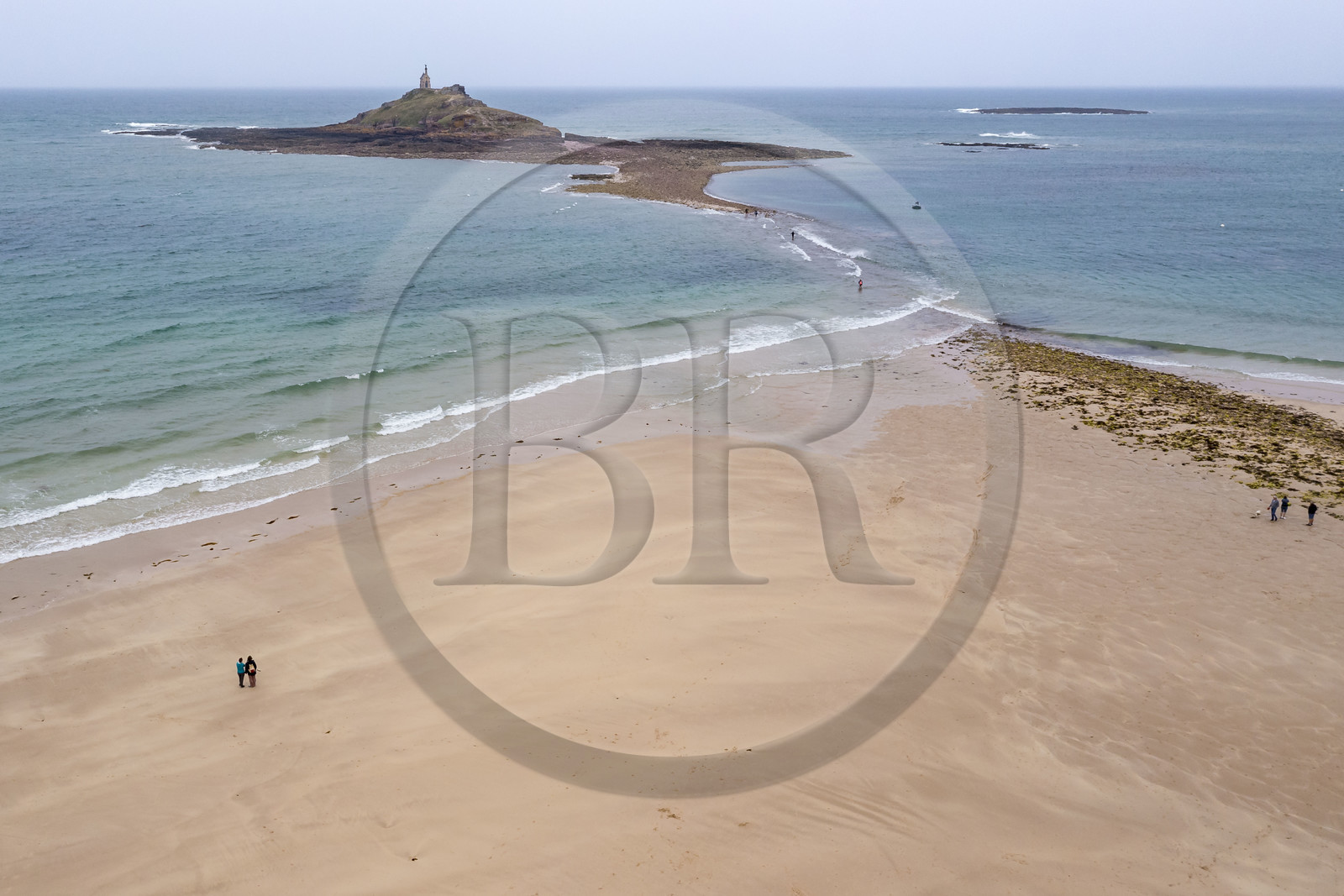 France, Cotes d'Armor, Grand Site de France Cap d'Erquy - Cap Frehel, Erquy, the Saint-Michel islet topped by the Saint-Michel chapel accessible on foot at low tide, passage of the tombolo at rising tide (aerial view)