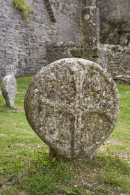 France, Aveyron, Causses and the Cévennes, cultural landscape of Mediterranean agro-pastoralism, listed as World Heritage by UNESCO, La Couvertoirade, labelled Les Plus Beaux Villages de France (The Most Beautiful Villages of France), fortified village on the Larzac plateau, discoidal tombstone, replica of a medieval cross stele discovered on the Larzac, in the cemetery in front of Saint-Christol church