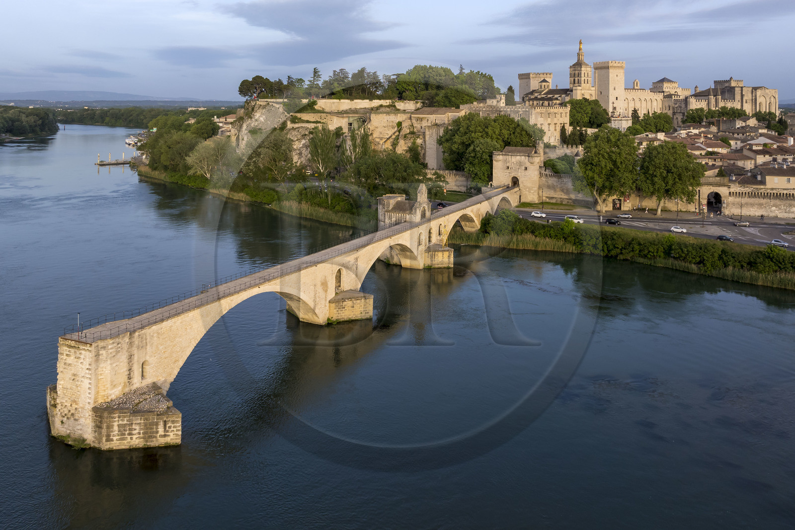 France, Vaucluse, Avignon, the Saint-Bénézet bridge (Pont d'Avignon) on the Rhone river and the Palais des Papes (Palace of the Popes), listed as World heritage by UNESCO, in the background (aerial view)