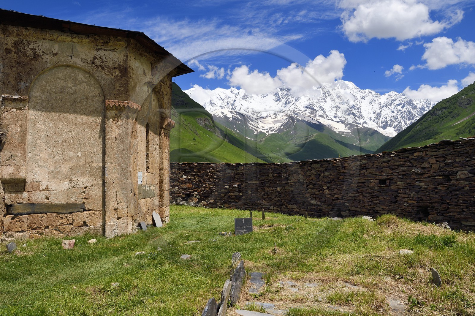 Georgia, Upper Svaneti (Zemo Svaneti), village of Ushguli, listed as World heritage by UNESCO, Lamaria St. Mary's church of Ushguli from the 12th century and Mount Chkhara (highest peak in Georgia with 5,193 m) in the background