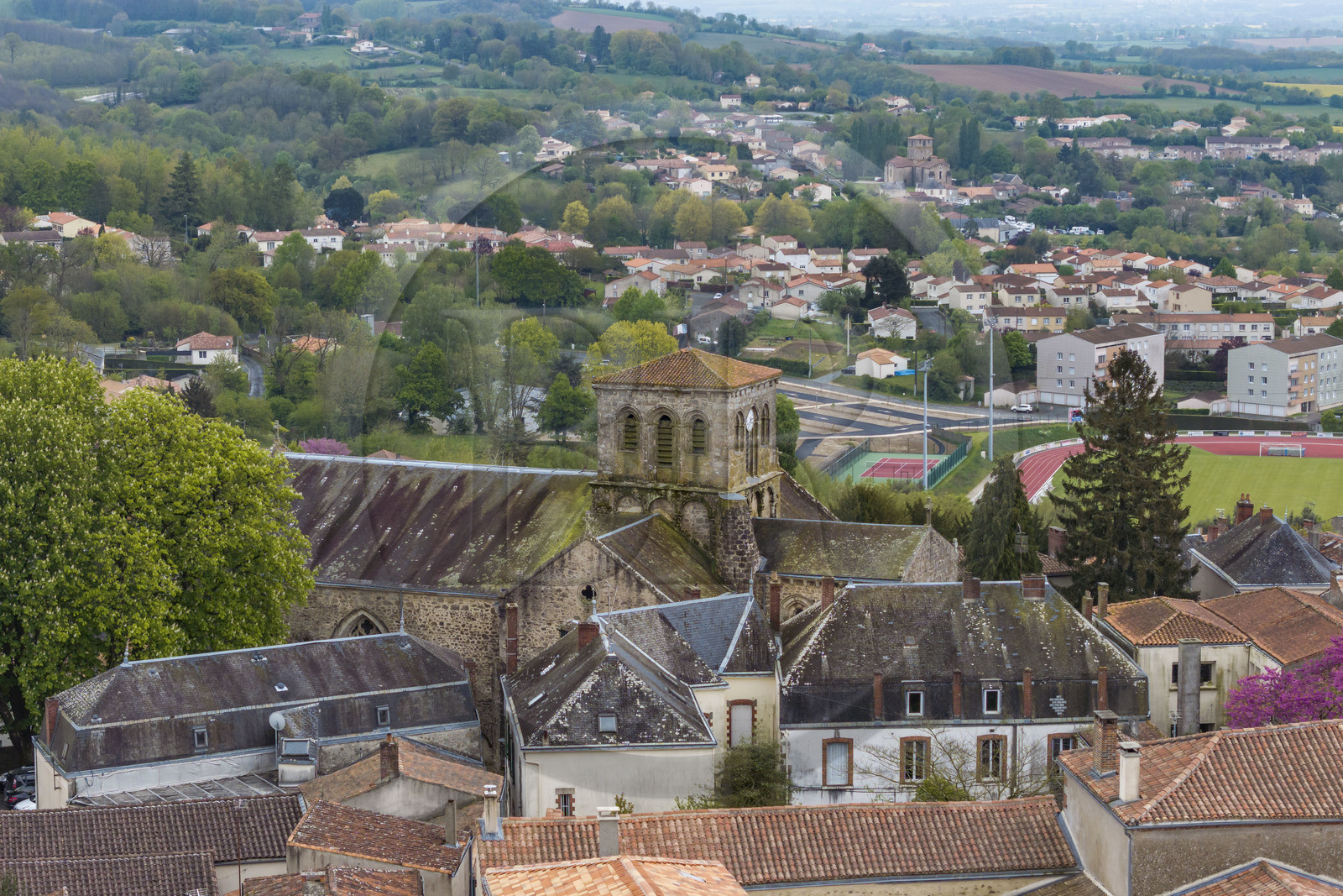 France, Vendee, Pouzauges, the 12th century Saint-Jacques church in the foreground and the 11th century Notre-Dame du Vieux Pouzauges church in the background (aerial view)