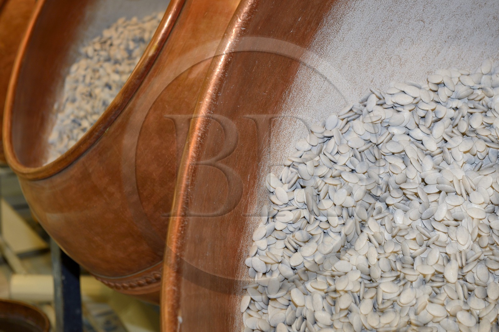 France, Meuse, Verdun, Braquier sugared almonds (dragee) factory, peeling almonds, operation designed to cover the almonds with a film and prevent oil from migrating to the outside