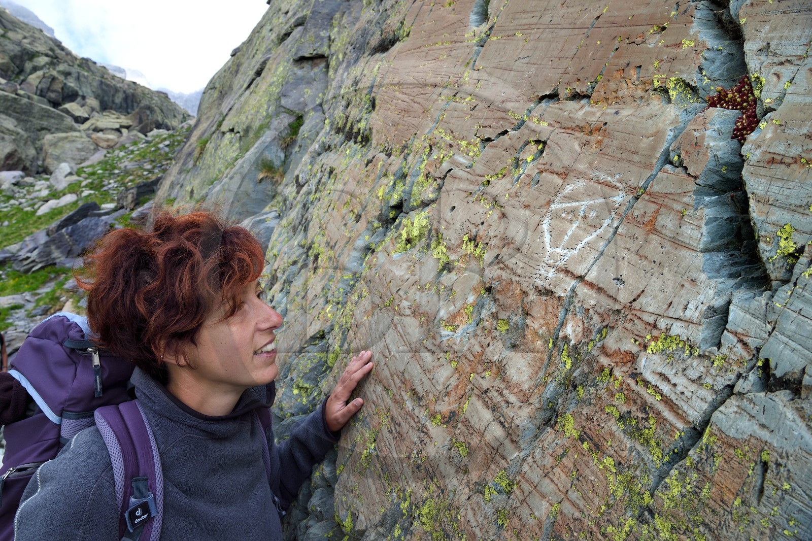 France, Alpes-Maritimes, parc national du Mercantour (Mercantour National Park), the Vallee des Merveilles (Valley of Wonders) scattered with thousands of rupestral engravings of the Bronze Age, the archaeologist Nicoletta Bianchi studies the hornlike anthropomorphized figure engraved on the so called rock of the Christ