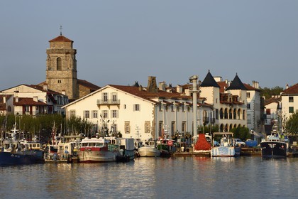 France, Pyrenees Atlantiques, Basque Country, Saint Jean de Luz, the fishing port, the white facade of the town hall, the house of Louis XIV on the right and the Saint-Jean-Baptiste (Saint John the Baptist) Church