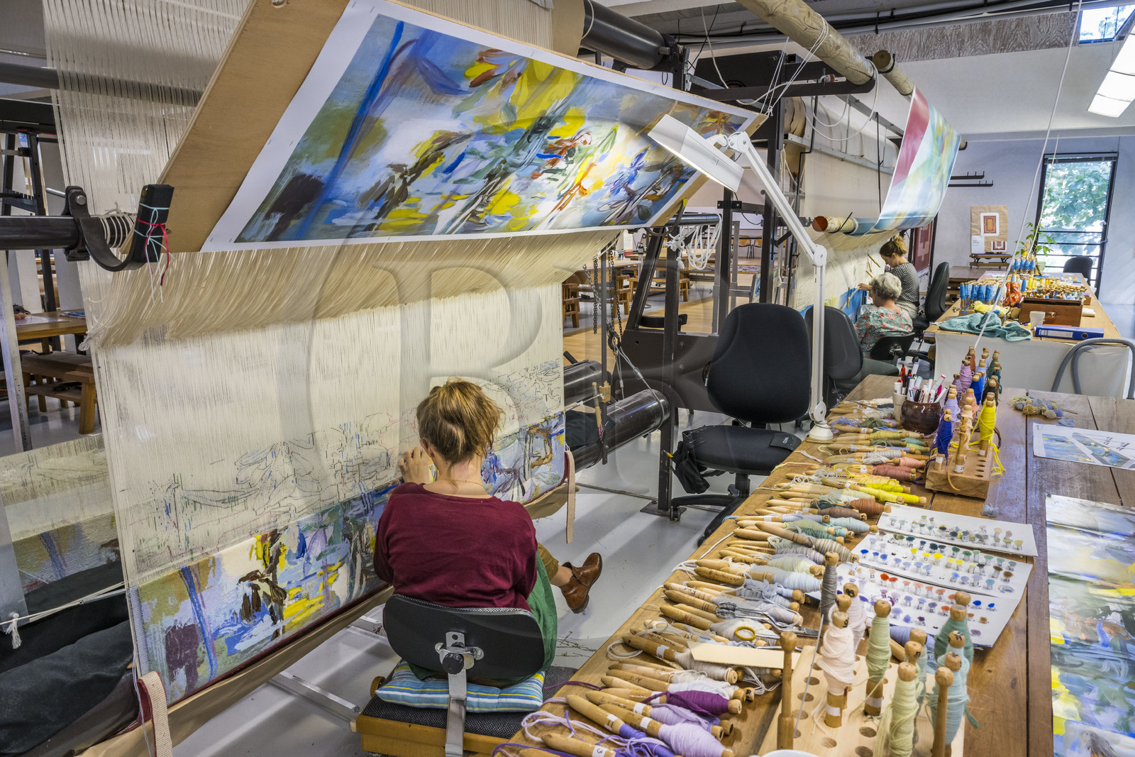 France, Herault, Lodève, Manufacture de la Savonnerie (Savonnerie manufactory) unique annex of the National Carpet Factory of the Savonnerie des Gobelins in Paris, realization by the weaver Kristell Corbinais on a loom of a seat tapestry for the bench L'Iris dans la vallée designed by Philippe Borderieux