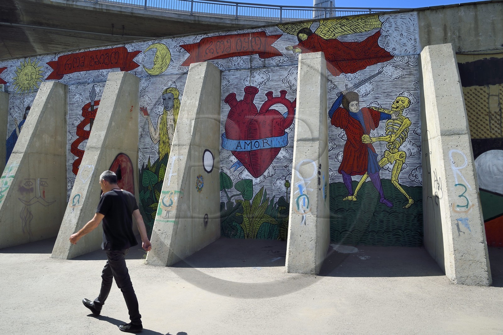 Georgia, Tbilisi, passage under fast tracks with walls covered with graffiti