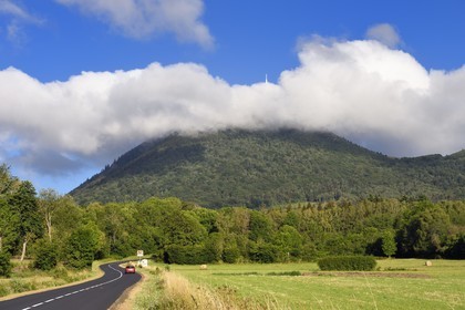France, Puy de Dome, Parc Naturel Régional des Volcans d'Auvergne (regional nature park of Auvergne volcanoes), Chaine des Puys listed as World heritage by UNESCO, the Puy de Dôme volcano whose summit is in the clouds