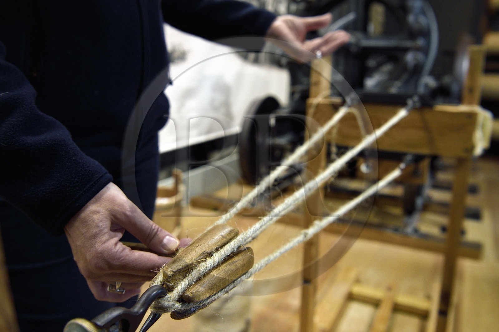 France, Charente-Maritime, Rochefort, International Center of the Sea in the former Rochefort Maritime Dock, the Corderie Royale (Royal Ropery) designed by Colbert in 1666, demonstration of the ropemaker job, the stranding which makes it possible to manufacture the rope from threads