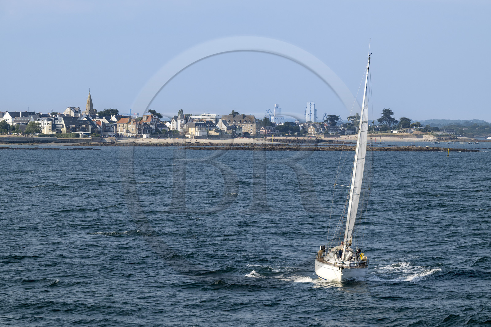 France, Morbihan, sailboat in the harbor of Lorient and Larmor-Plage in the background