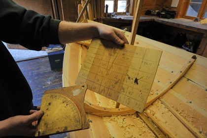 Norway, Hordaland County, Norheimsund, Fartoyvernsenter Boat Preservation Centre, renovation workshop, wooden boat with oar traditionally built by Bjorn Kvalvik