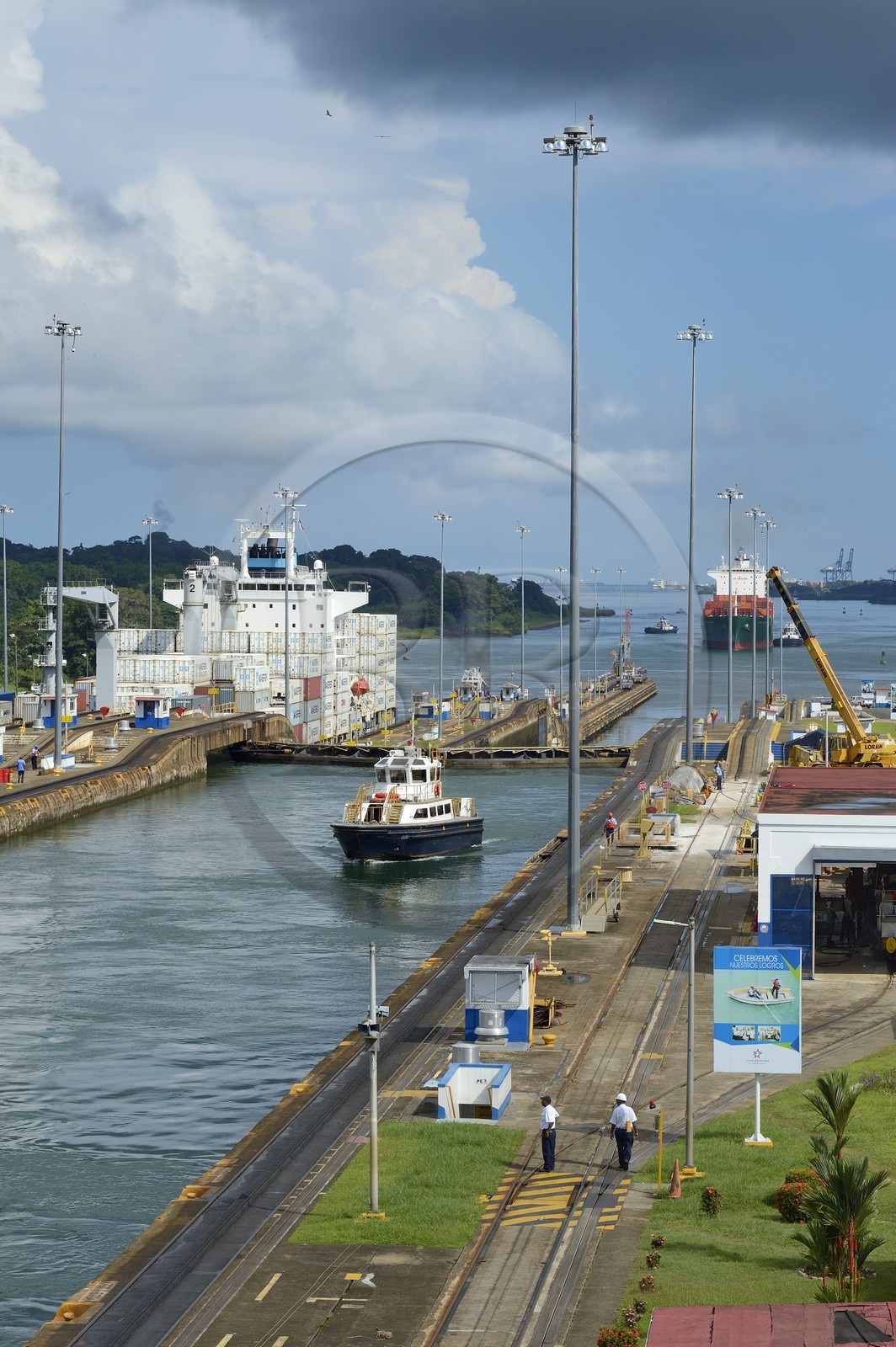 Panama, Colon province, Panama Canal, Gatun locks, Panamax container ship passing the lock, tugboat