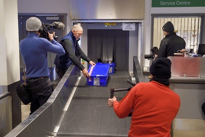Norway, Svalbard, Spitzbergen, Longyearbyen, Svalbard Global Seed Vault (Seed Bank), scanning of seeds at the airport baggage claim area performed by NordGen, cameramen team of the international press filming the arrival of the boxes