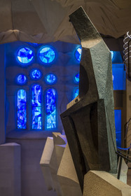 Spain, Catalonia, Barcelona, Eixample district, Sagrada Familia basilica by Catalan modernist architect Antoni Gaudi, listed as a UNESCO World Heritage Site, bronze statue of Saint George (Sant Jordi) by the sculptor Subirachs in the center of the interior of the Glory facade and the east side of the Nave in cold colors