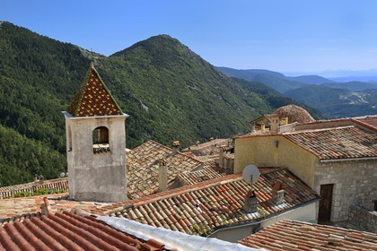France, Alpes-Maritimes, the hilltop village of Peille, the Nice Bay and the Esterel mountains in the background right