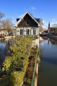 France, Bas Rhin, Strasbourg, old town listed as World Heritage by UNESCO, la Petite France District, corner Ponts Couverts and quai du Woerthel along one of the branches of the Ill river and the Cathedral in the background