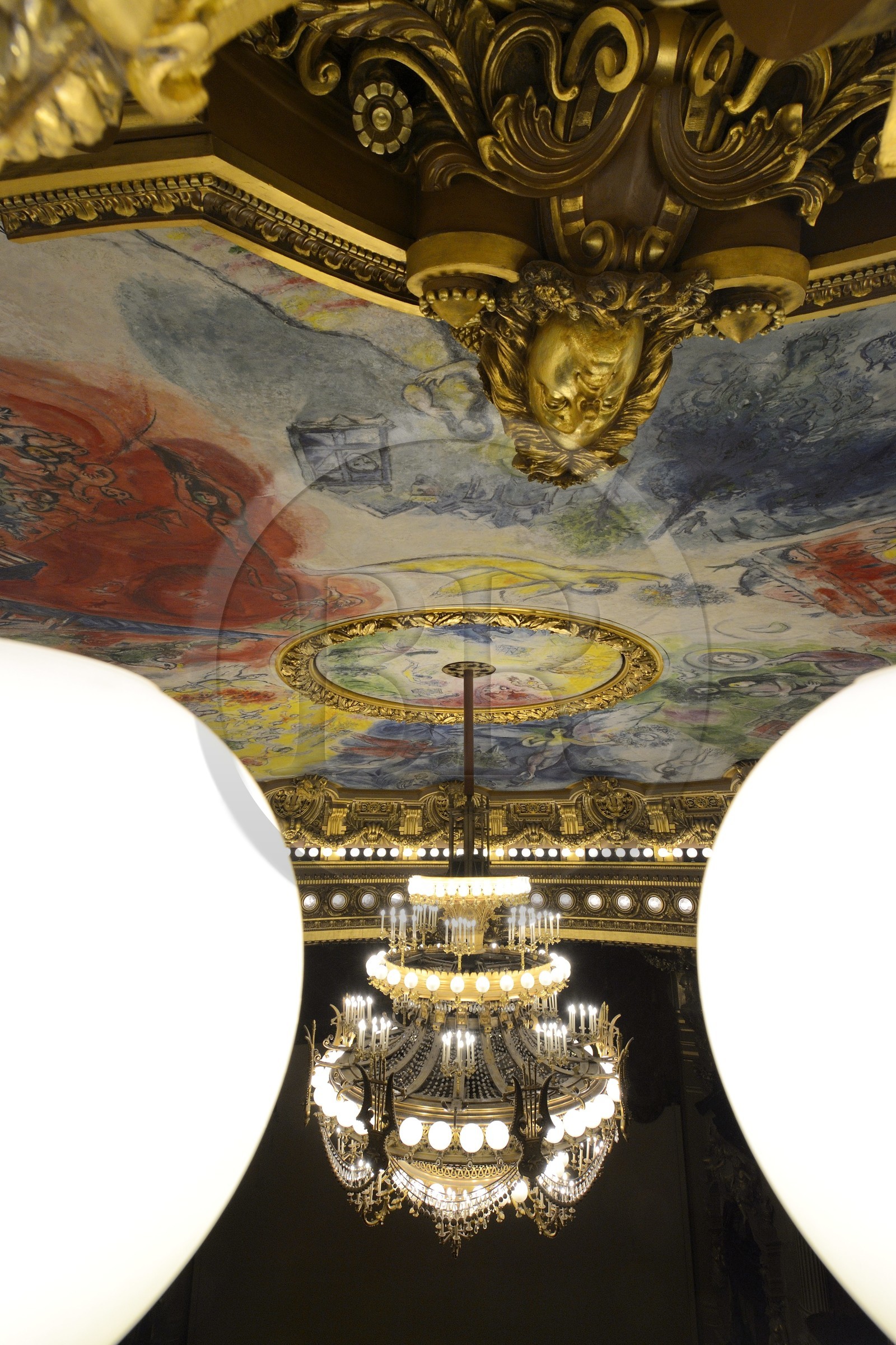 France, Paris, Garnier Opera, the ceiling cupola decorated by Marc Chagall in the auditorium and the 7 to 8 ton bronze and crystal chandelier designed by Garnier