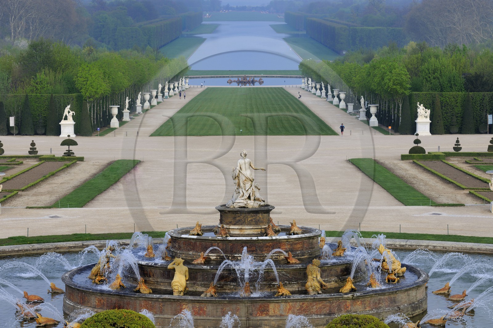 France, Yvelines, park of the Chateau de Versailles, listed as World Heritage by UNESCO, the Latona Basin and gardens perspective and the Axe du Soleil (the Sun Axis) to the Grand Canal