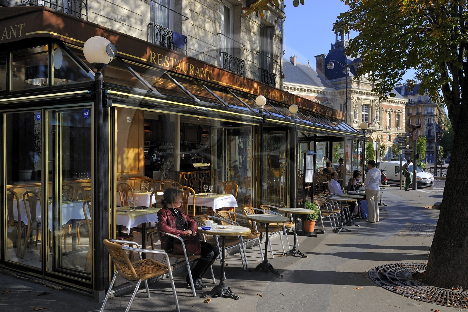 France, Paris, brasserie Le Napoleon III and the city hall of the 19th arrondissement in the background