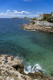 France, Bouches du Rhone, Marseille, Endoume district, the white rock beach of Petit Nice going from the cove of Fausse-monnaie to the cove of Maldormé, the small fort of Degaby Island and the Frioul Islands Archipelago in the background