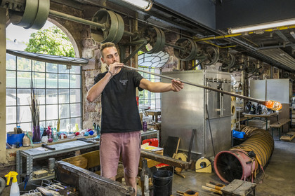 France, Moselle, Meisenthal, Centre international d'Art verrier (CIAV) (international glass centre), the glassmaker Geoffrey Richard in the blowing workshop