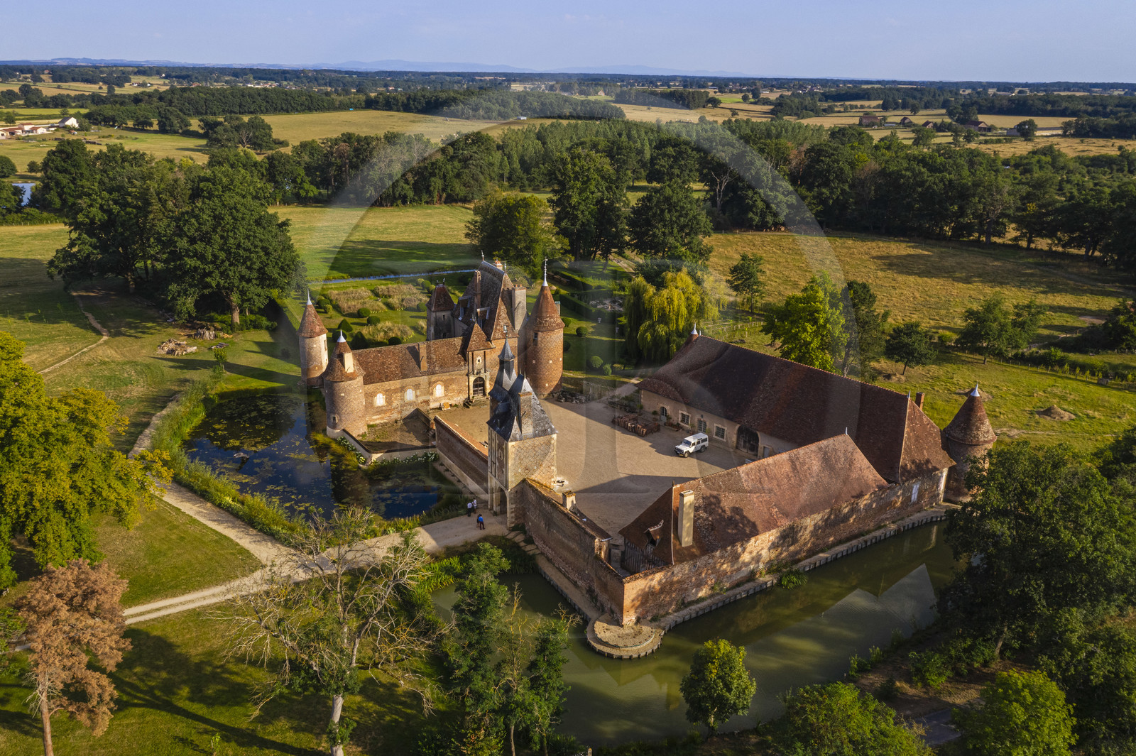 France, Allier (03), former province of Bourbonnais, Chapeau, Chateau de la Cour (15th century to late 16th century) and its moat (aerial view)