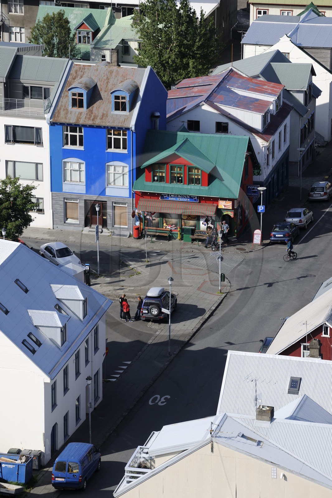 Iceland, Reykjavik, colorful buildings in the old town with a neighborhood grocery store