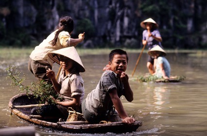 Vietnam, the river Hoa Lu, called the terrestrial bay of Halong, small boat trip in the caves