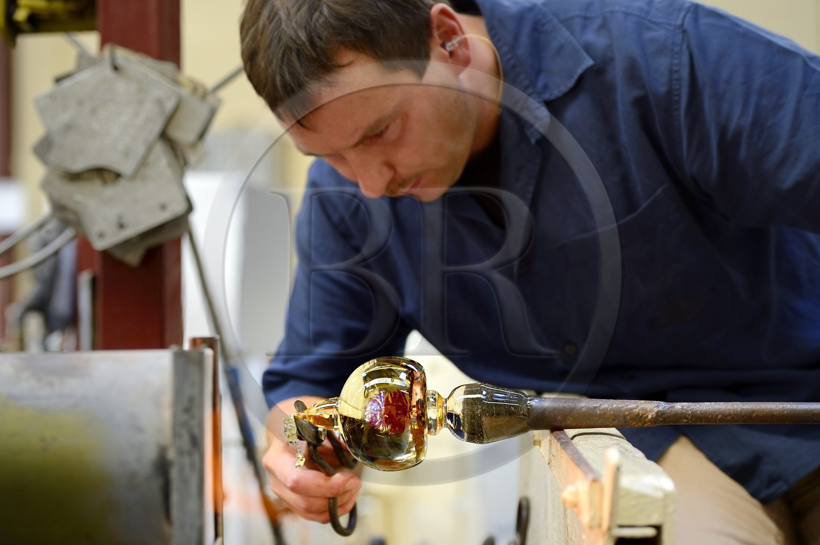 France, Moselle, Saint-Louis-les-Bitche, the Cristallerie Saint-Louis (Saint-Louis crystal glass manufacturer), shaping a hot crystal element, one of the many steps of the realization of a paperweight