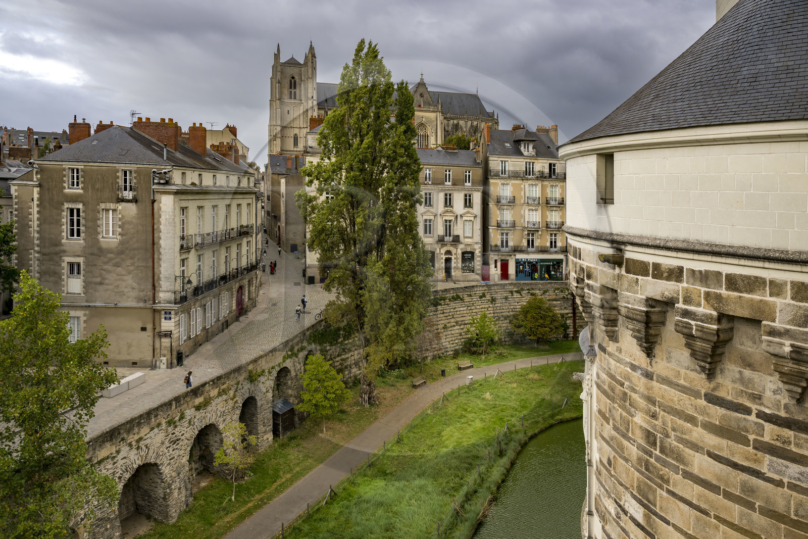 France, Loire Atlantique, Nantes, Bouffay district, the castle of the Dukes of Brittany, the moats and rue Mathelin Rodier which goes up towards the Saint Pierre and Saint Paul cathedral in the background