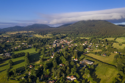 France, Puy de Dome, Parc Naturel Régional des Volcans d'Auvergne (regional nature park of Auvergne volcanoes), village of Laschamps east of the volcanoes of the Chaine des Puys listed as World heritage by UNESCO (aerial view)