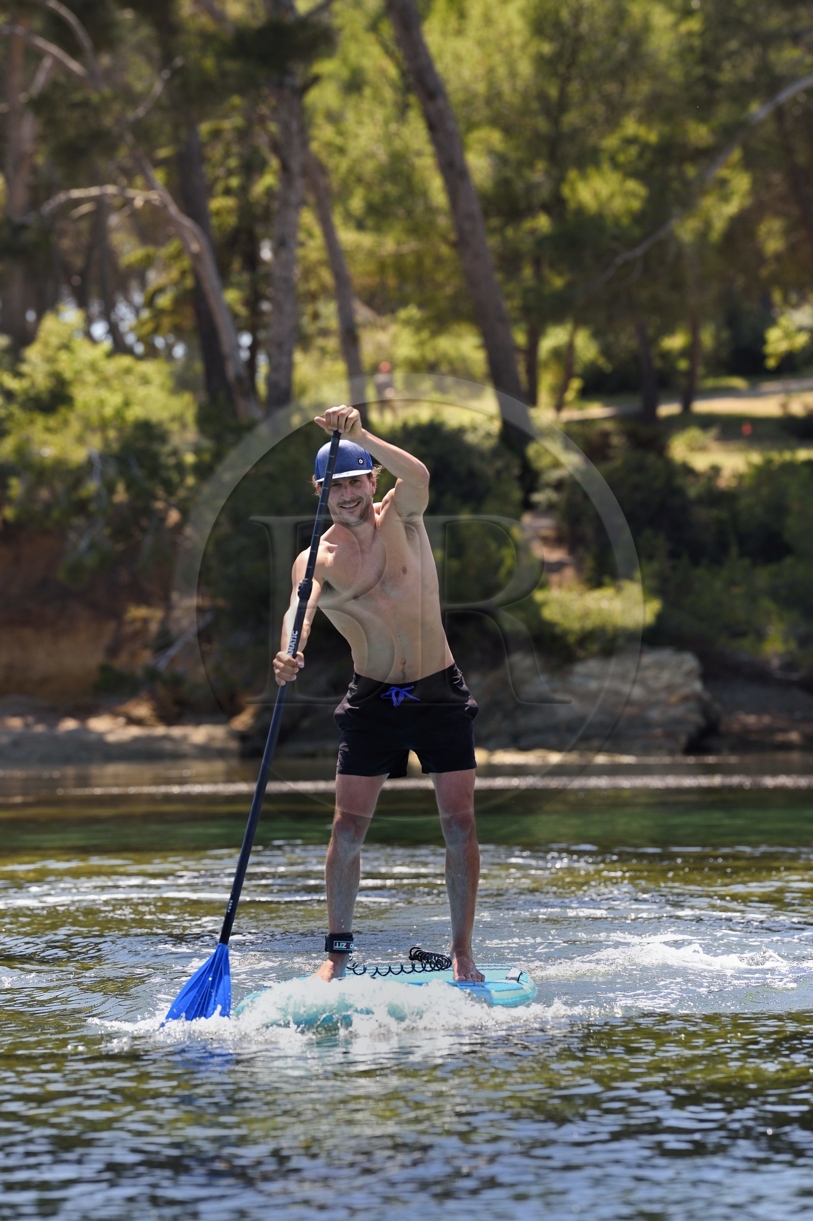 France, Var, Six Fours les Plages, Ile des Embiez, cape of Canoubié, Freestyle windsurfing champion Adrien Bosson on a paddle boarding excursion