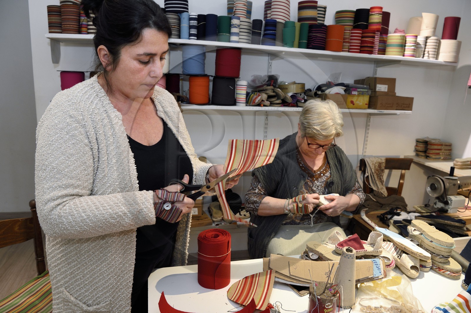 France, Pyrenees Atlantiques, Basque Country, Saint Jean Pied de Port, Albertine Arangois and her daughter Patricia in their shop and craft factory of espadrilles
