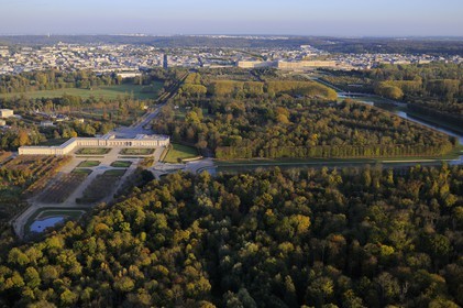 France, Yvelines, Chateau de Versailles Park, listed as World Heritage by UNESCO, the Grand Trianon in the foreground and the castle in the background (aerial view)
