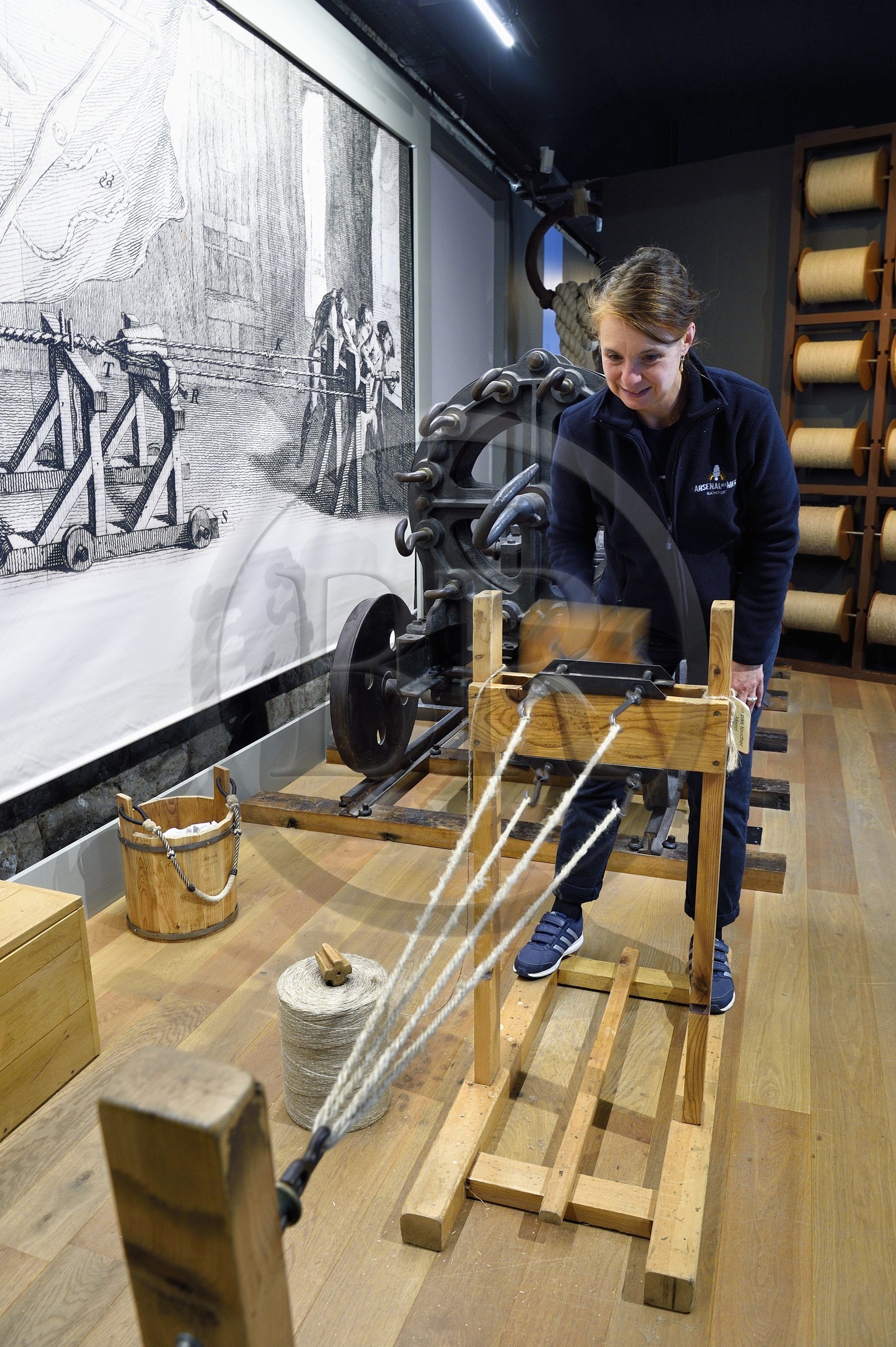 France, Charente-Maritime, Rochefort, International Center of the Sea in the former Rochefort Maritime Dock, the Corderie Royale (Royal Ropery) designed by Colbert in 1666, demonstration of the ropemaker job, the stranding which makes it possible to manufacture the rope from threads