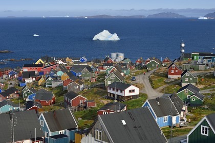 Greenland, west coast, Baffin Bay, the town of Upernavik and icebergs in the background