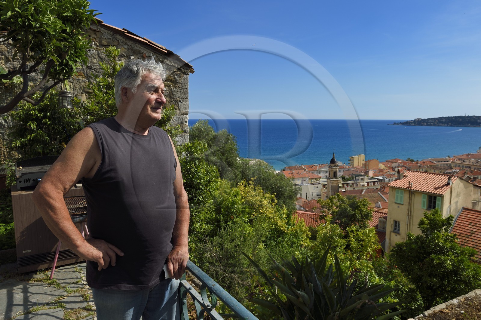 France, Alpes-Maritimes, Menton, old town, Germain Vernis observes the old town from his terrace