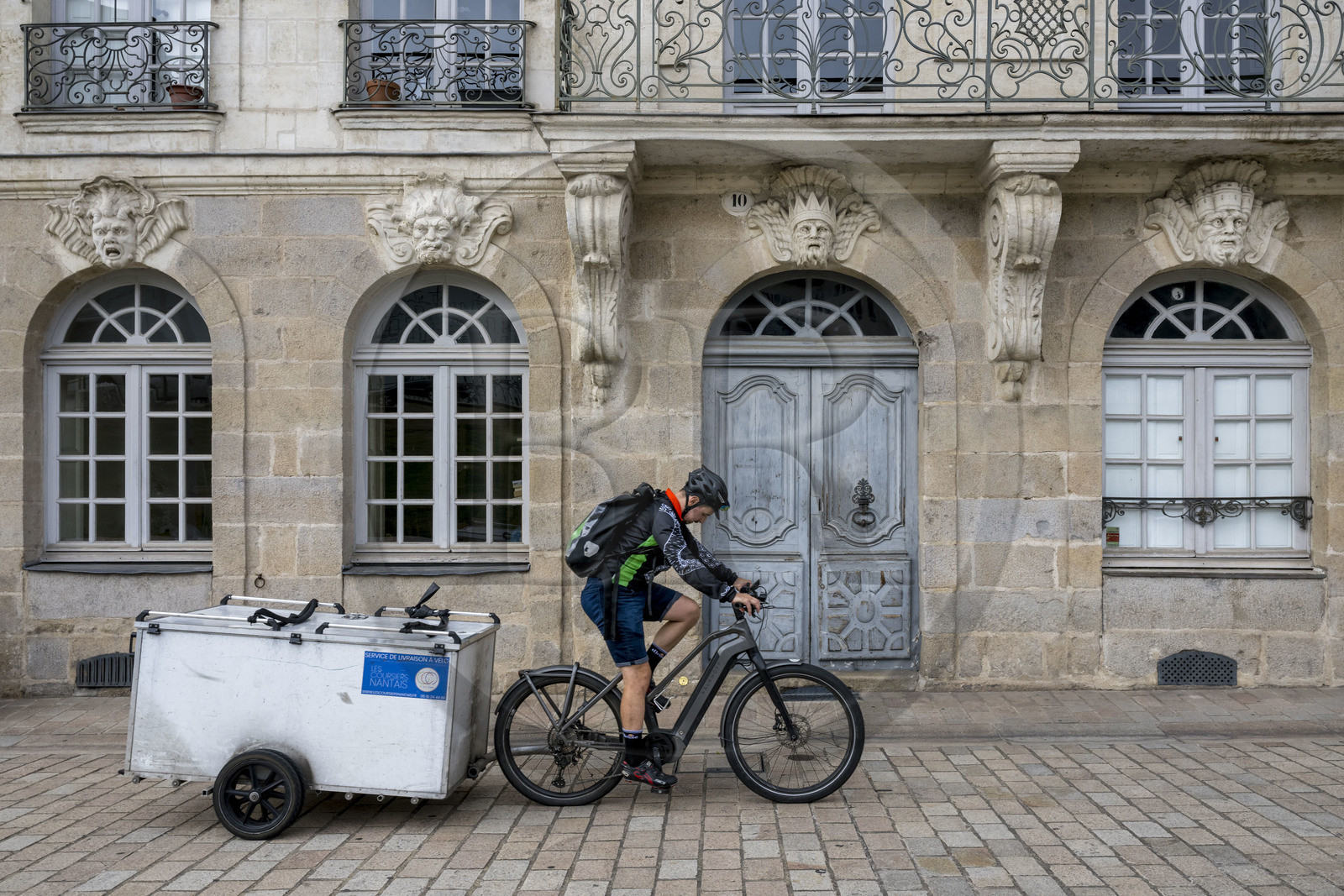 France, Loire Atlantique, Nantes, shipowner's house on 10 Quai Turenne on the former Ile Feydeau, bicycle with trailer delivery service