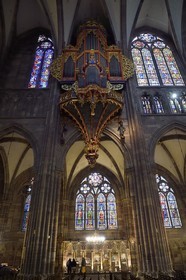 France, Bas Rhin, Strasbourg, old town listed as World Heritage by UNESCO, Notre Dame Cathedral, the great organ overlooking the nave, the automaton called the Rohraffe (also Bretzelmann) on the right under the great organ, from there the faithful and the clergy were insulted during the services of the festivals of Pentecost, on the left a herald brings a trumpet to his mouth with the help of cables drawn by the organist
