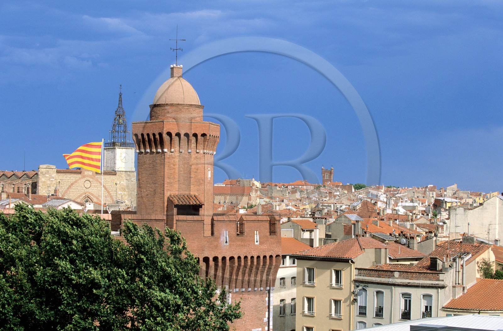 France, Pyrenees Orientales, Perpignan, Castillet with the catalan flag and the Saint john cathedral